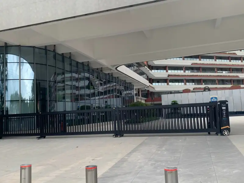 success case 24m telescopic sliding gate at Shunde Beijiao Experimental High School main entrance, part of Physical Defense + Intelligent Management ecosystem securing 2,000+ students