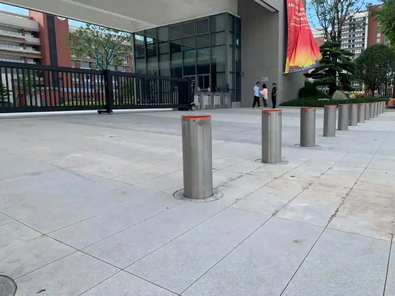 Smart campus success case: Main entrance overview of Shunde Beijiao High School with 24m telescopic sliding gate and 16 automatic lifting columns by Zhanjiang