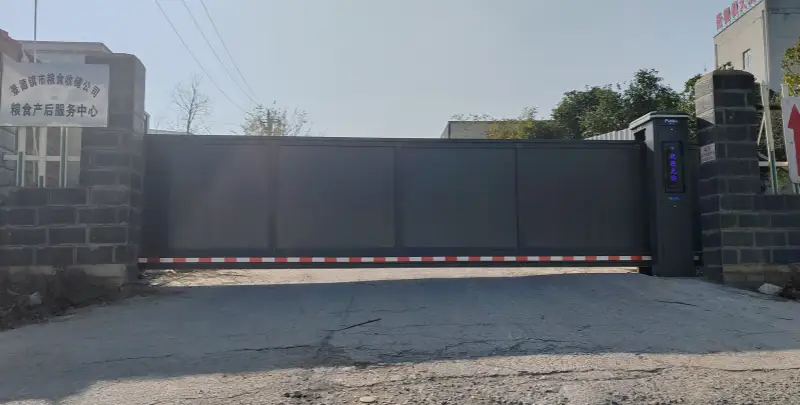 cantilever gate project at grain storage facility, high-security floating gate with full sealed panels, installed by Guangdong Zhanjiang Group in December 2024