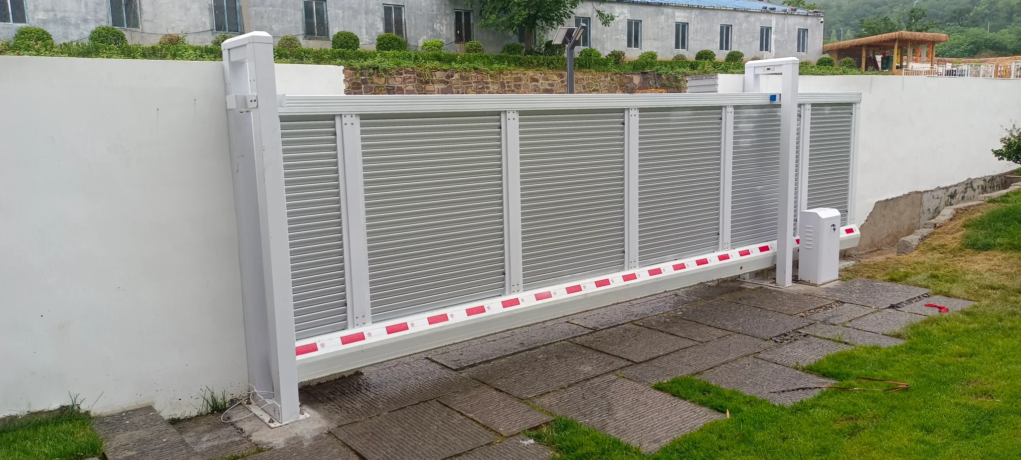 Automatic Trackless Suspended Gate with White Powder Coated Finish Installed On Site