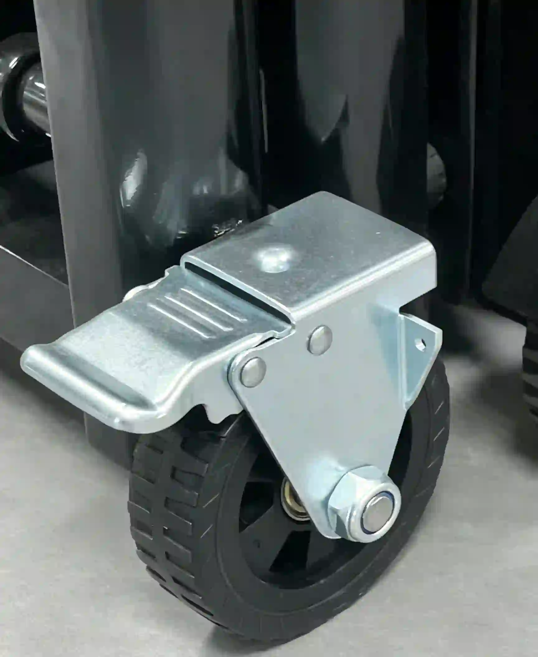 Heavy duty caster wheel with brake for road barrier