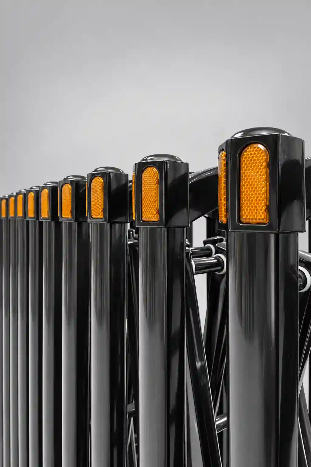 Accordion road barrier close-up, reflective warning strips for night safety